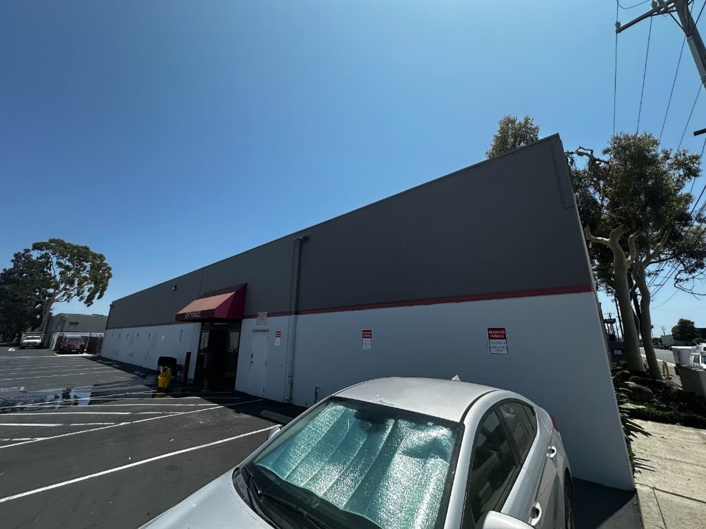 Active warehouse aisle with organized inventory and fulfillment operations